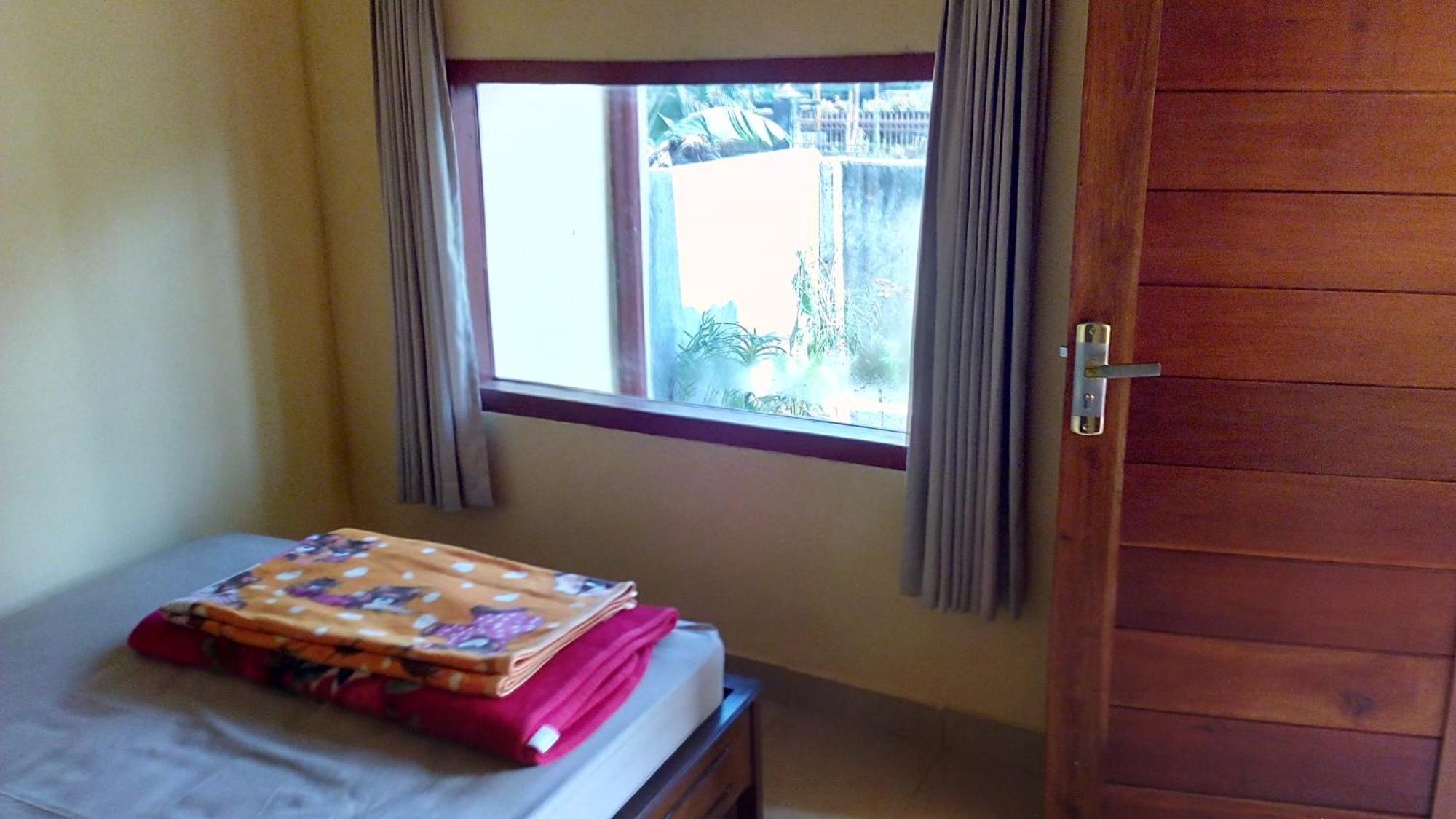 Radiya Guesthouse سيمبالون لوانج الغرفة الصورة